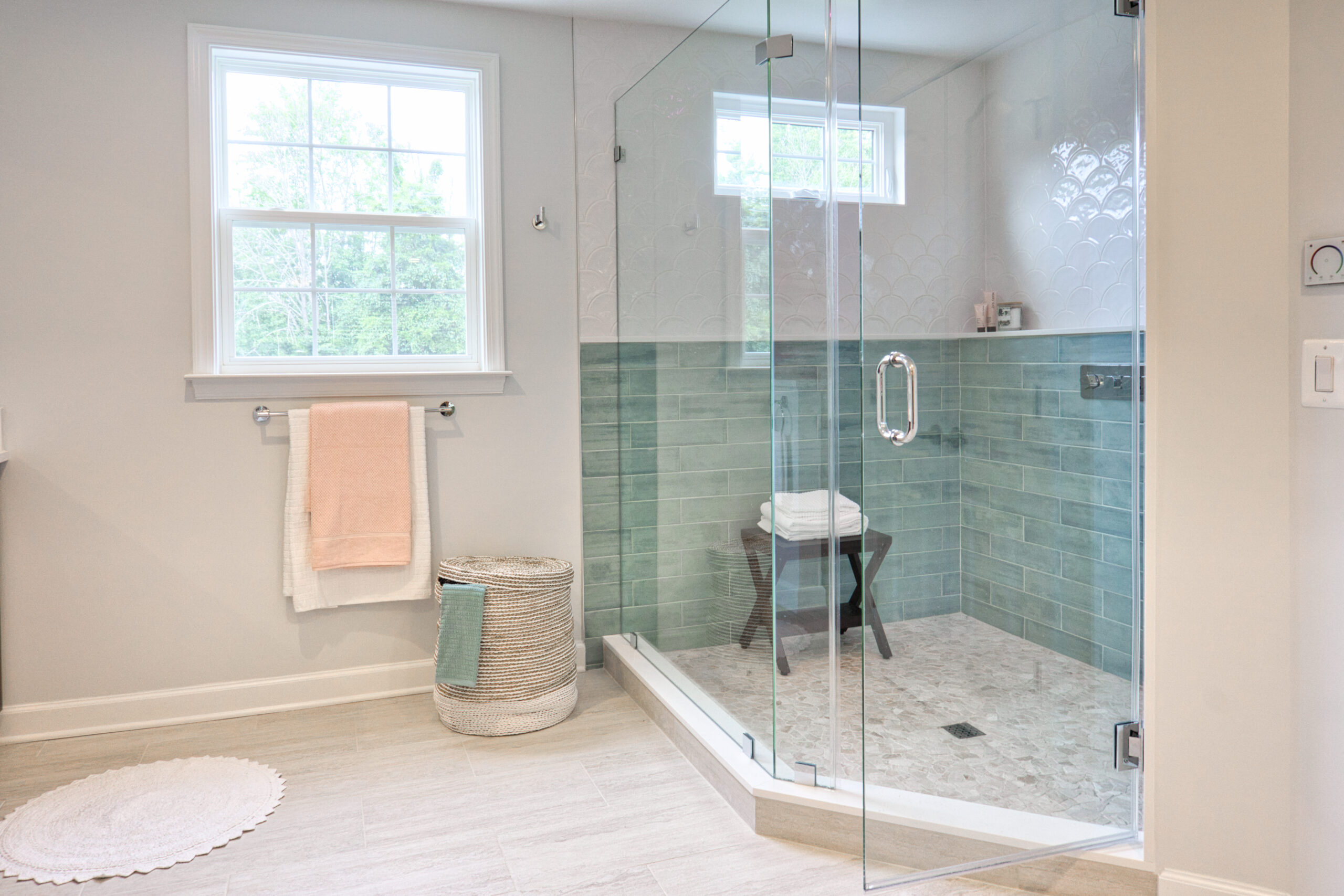 The interior of a modern bathroom with a shower box